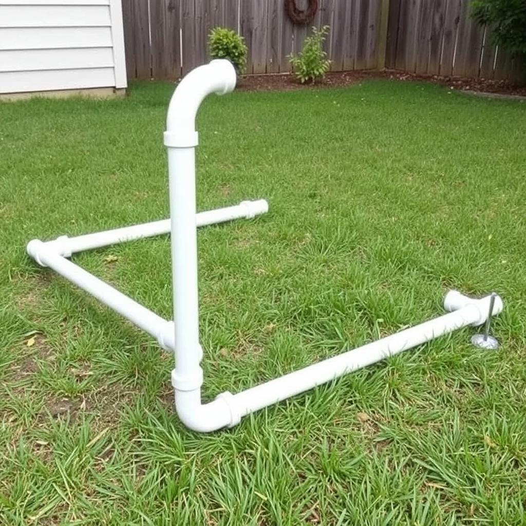 PVC pipe puppy pen stabilized in grass for outdoor use PVC pipe puppy pen stabilized in grass for outdoor use
